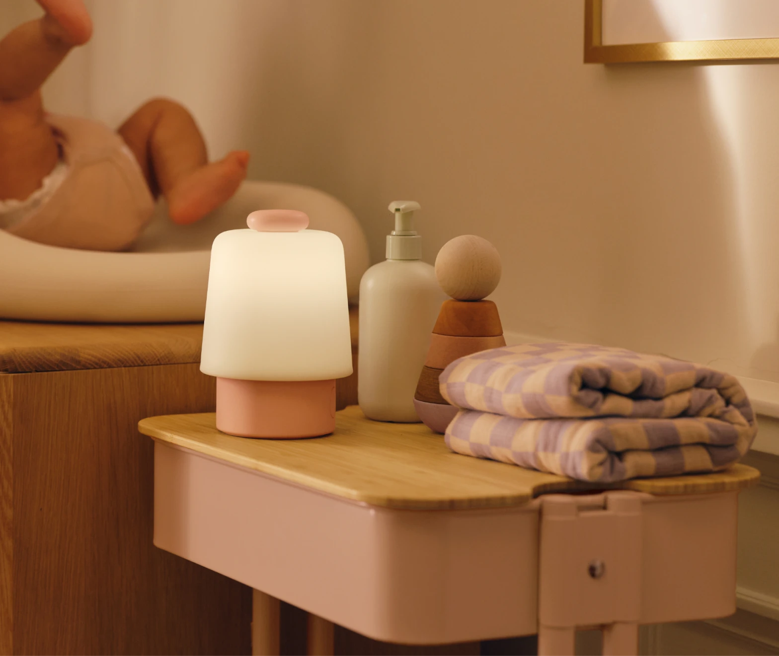 Hatch baby peach colorway on a nursery changing table