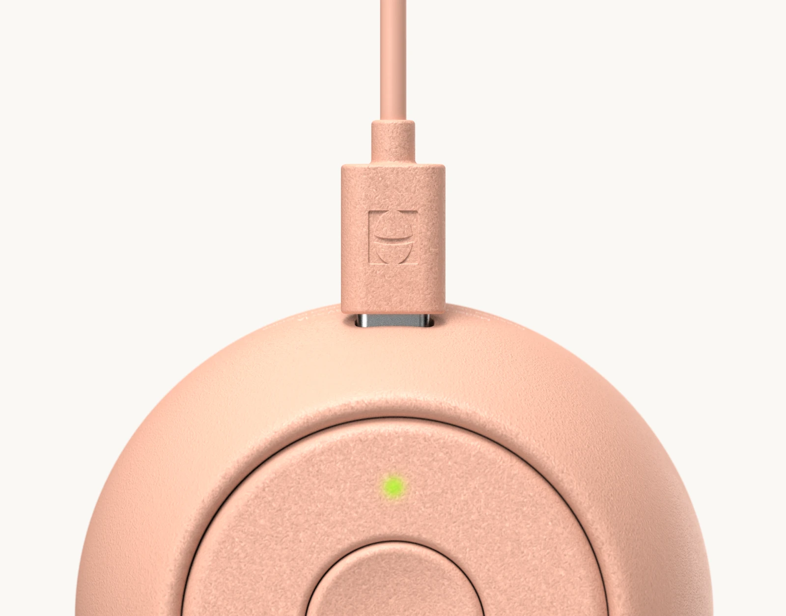 Hatch Go Peach with charger plugged in