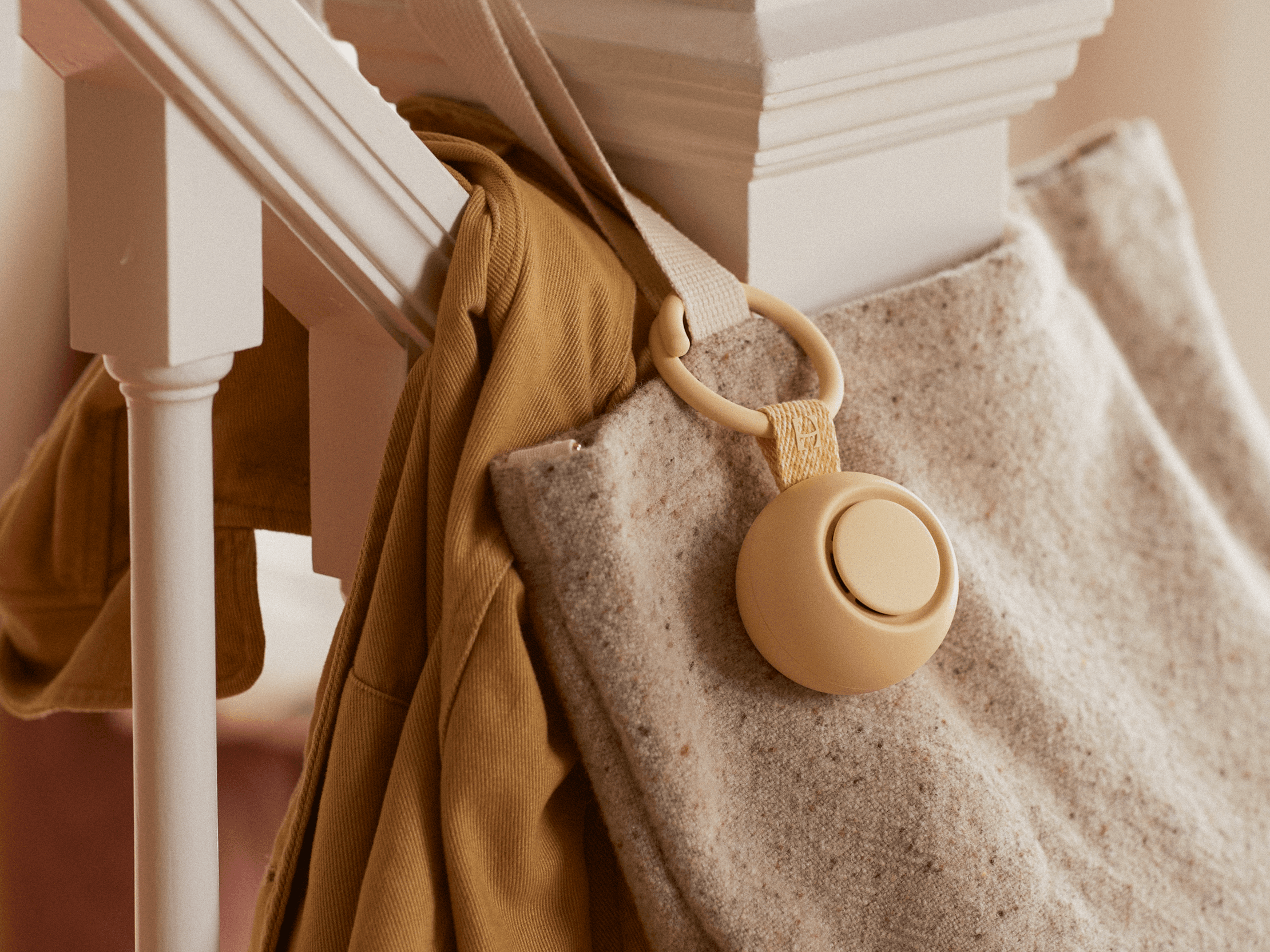 Hatch Go honey colorway clipped to a mother's tote bag