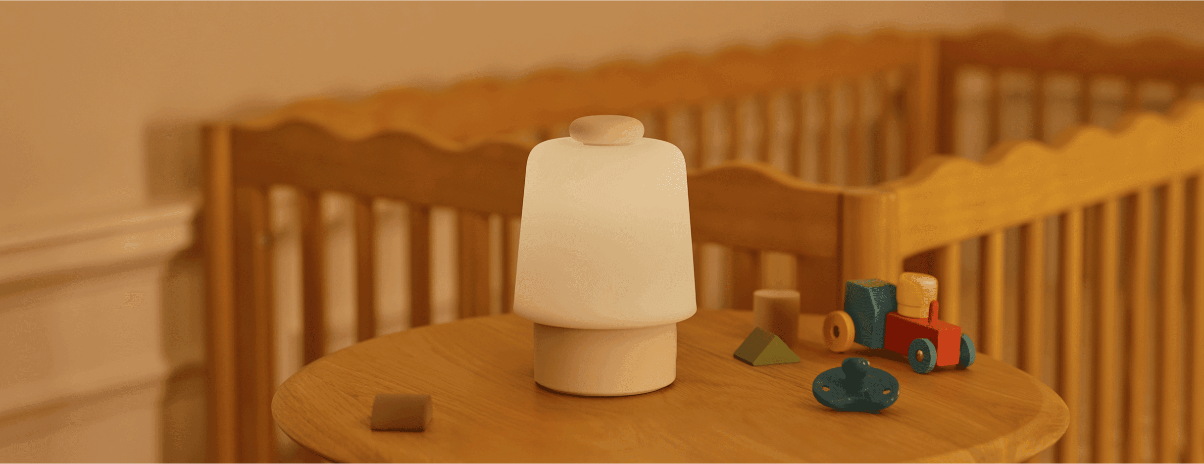 Hatch baby on a nursery's table next to some toys