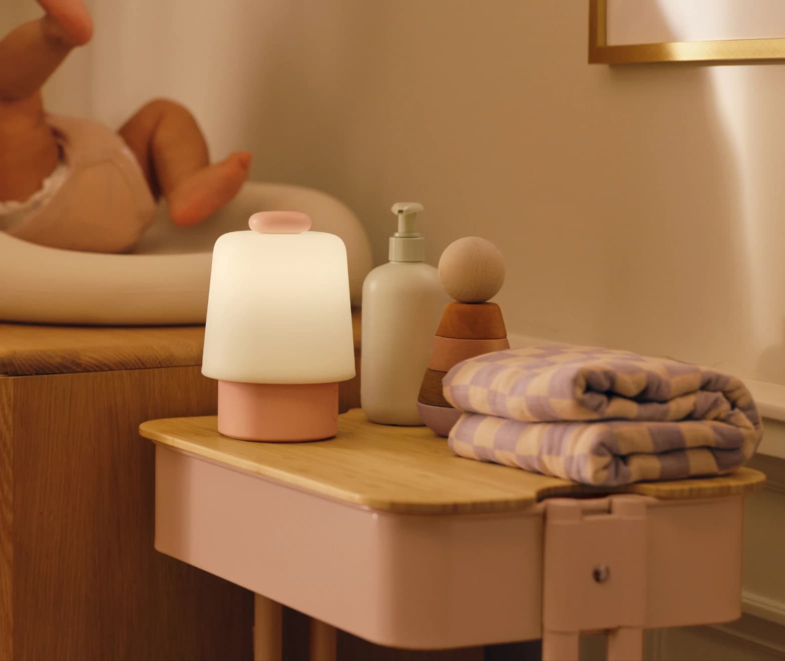 Hatch baby peach colorway on a nursery changing table